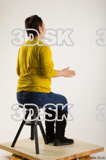 Sitting reference of yellow sweater blue jeans Gwendolyn 0012